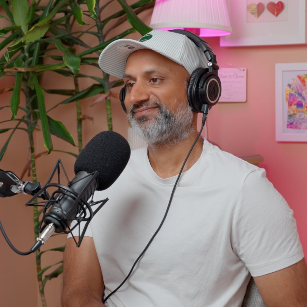 Sunjay smiling at the mic in the studio