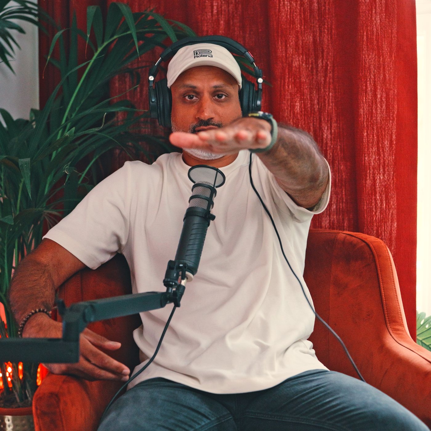 Sunjay at the mic in the studio, reaching towards the camera